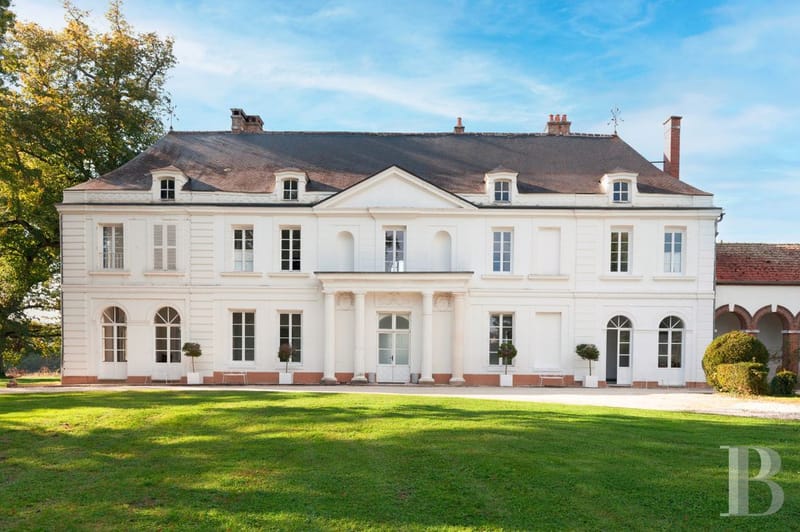 Twilight view of a French country estate